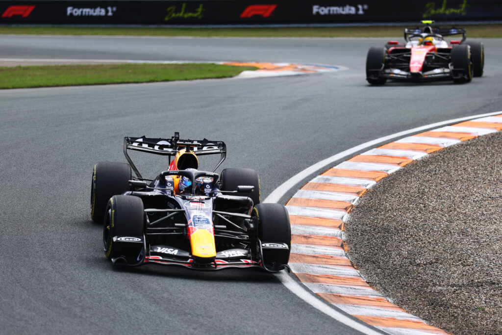 ZANDVOORT, NETHERLANDS - AUGUST 22: Max Verstappen of the Netherlands driving the (3) Oracle Red Bull Racing RB22 Red Bull Ford Powertrains leads Lewis Hamilton of Great Britain driving the (44) Scuderia Ferrari SF-26 on track during the Sprint ahead of the F1 Grand Prix of Netherlands at Circuit Zandvoort on August 22, 2026 in Zandvoort, Netherlands. (Photo by Clive Mason/Getty Images) // Getty Images / Red Bull Content Pool // SI202608220047 // Usage for editorial use only //
