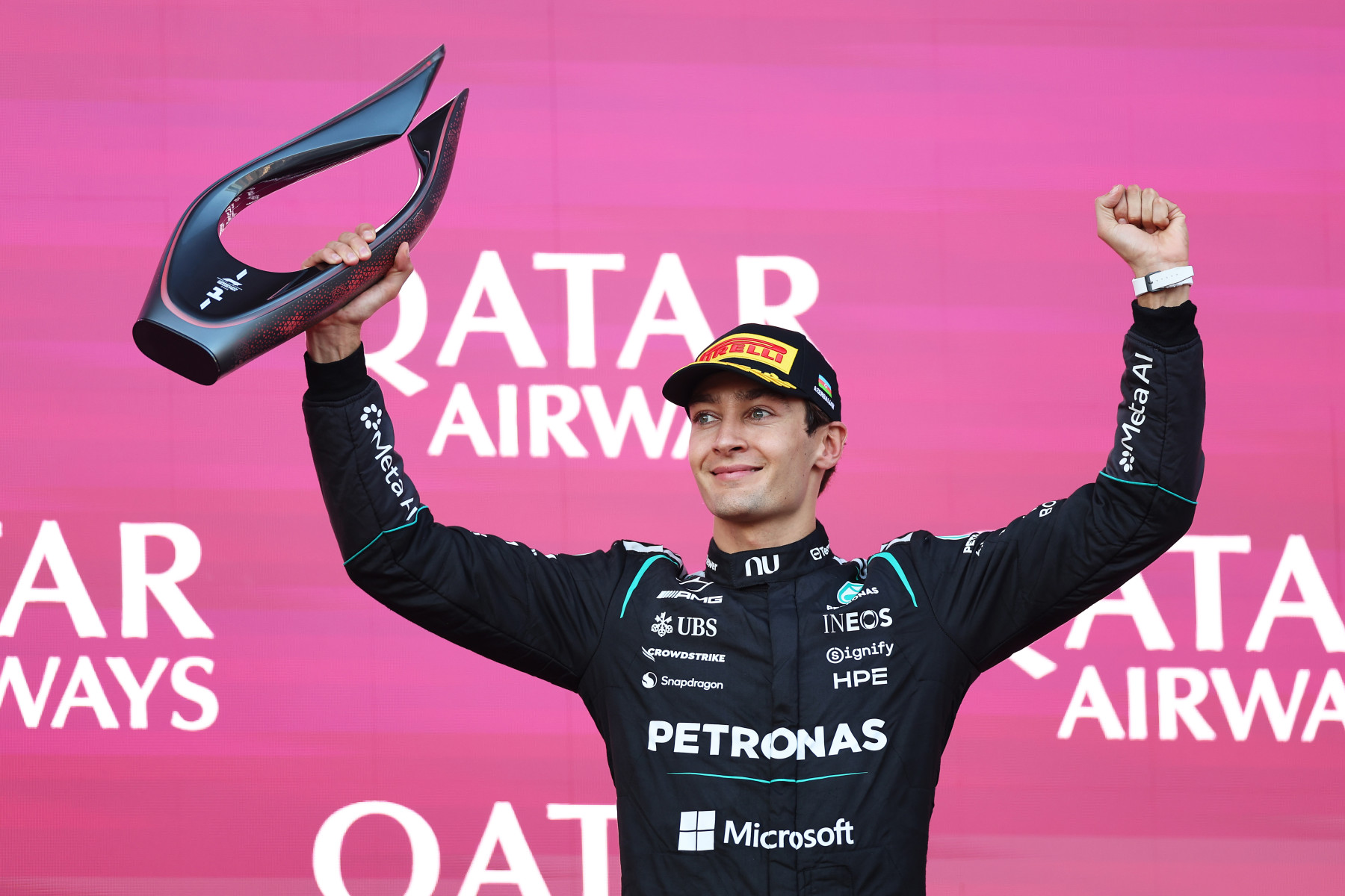 Race winner George Russell of Great Britain and Mercedes AMG Petronas F1 Team celebrates on the podium during the F1 Grand Prix of Azerbaijan at Baku City Circuit