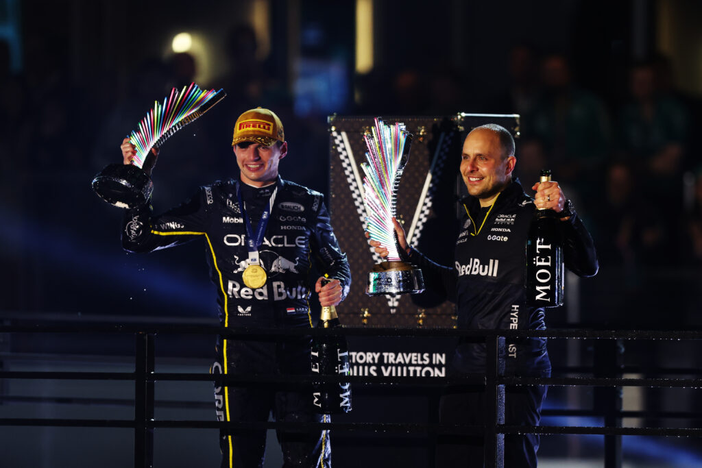 LAS VEGAS, NEVADA - NOVEMBER 22: Race winner Max Verstappen of the Netherlands and Oracle Red Bull Racing and Gianpiero Lambiase, Head of Racing of Oracle Red Bull Racing celebrate on the podium during the F1 Grand Prix of Las Vegas at Las Vegas Strip Circuit on November 22, 2025 in Las Vegas, Nevada. (Photo by Meg Oliphant/Getty Images)