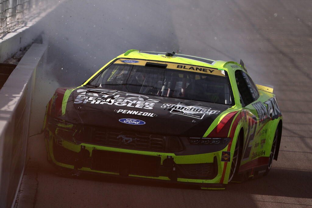 MADISON, ILLINOIS - SEPTEMBER 13: Ryan Blaney, driver of the #12 Menards/ATLAS Designer Shingles Ford, spins into the wall after an on-track incident during the NASCAR Cup Series Enjoy Illinois 300 at WWT Raceway on September 13, 2026 in Madison, Illinois. (Photo by Chris Graythen/Getty Images)