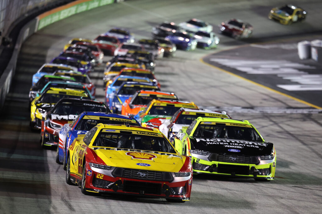 Joey Logano, driver of the #22 Shell Pennzoil Ford, and Austin Cindric, driver of the #2 Menards/Richmond Ford, race during the NASCAR Cup Series Bass Pro Shops Night Race at Bristol Motor Speedway on September 19, 2026 in Bristol, Tennessee. (Photo by Jonathan Bachman/Getty Images)