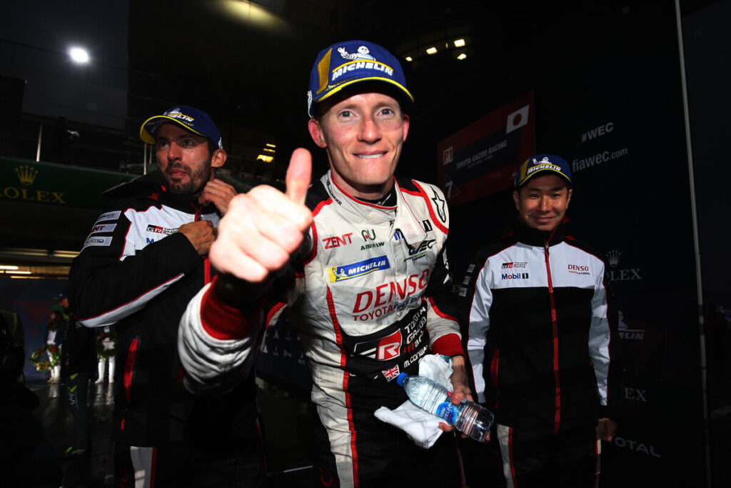 **FIA WEC 6h Shanghai 2018:** The winning crew of the #7 Toyota TS050 Hybrid – Mike Conway (center), José María López (left), and Kamui Kobayashi (right) – celebrates after taking victory in the LMP1 class at a rain-soaked Shanghai International Circuit.