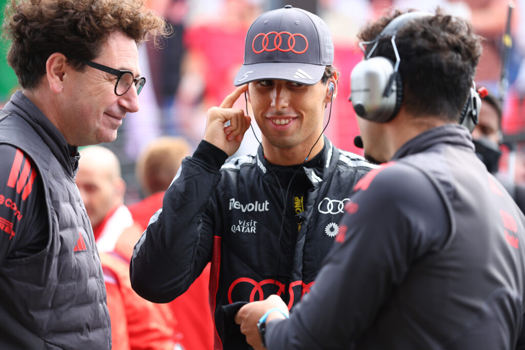 ZANDVOORT, NETHERLANDS - AUGUST 22: Mattia Binotto, CEO and Team Principal of Audi F1 Team and Gabriel Bortoleto of Brazil and Audi F1 Team on the grid during the Sprint ahead of the F1 Grand Prix of Netherlands at Circuit Zandvoort on August 22, 2026 in Zandvoort, Netherlands. (Photo by Andy Hone/LAT Images)