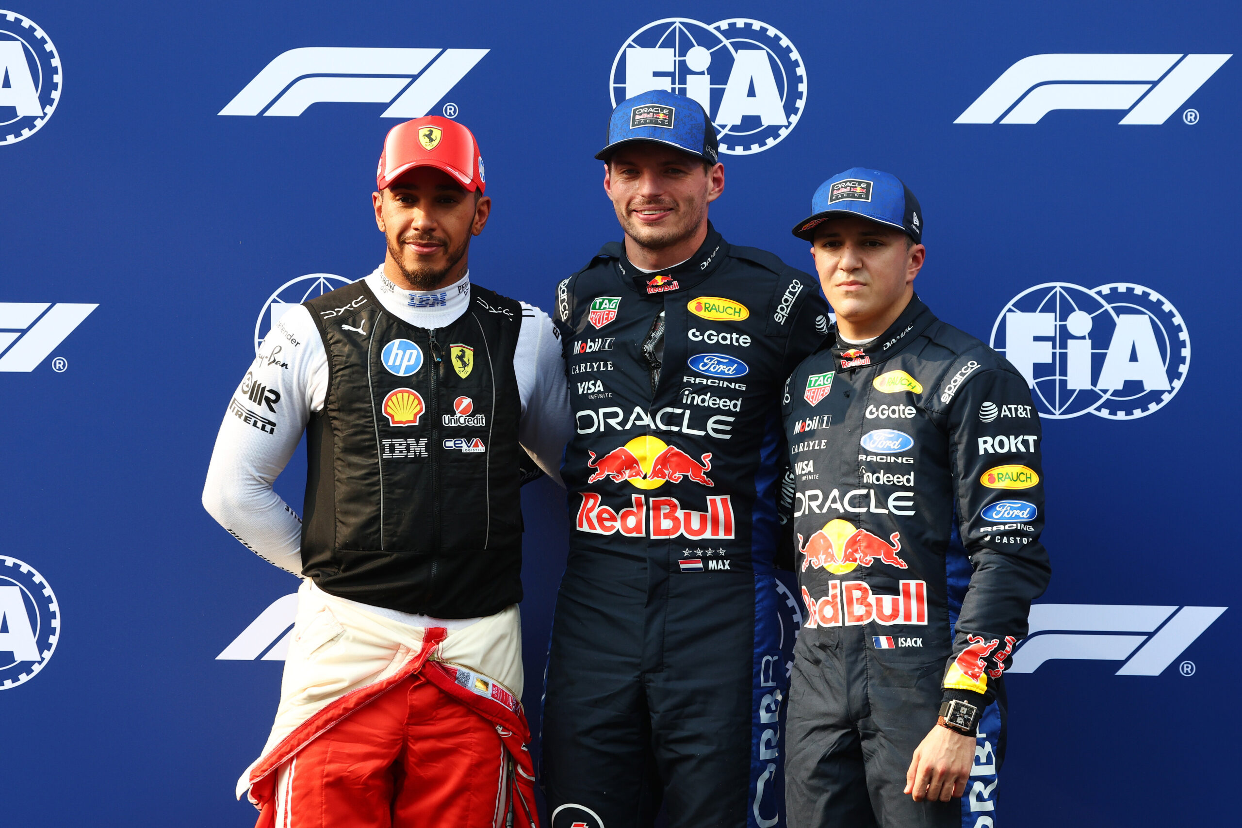 KUALA LUMPUR, MALAYSIA - OCTOBER 03: Pole position qualifier Max Verstappen of the Netherlands and Oracle Red Bull Racing Second placed qualifier Lewis Hamilton of Great Britain and Scuderia Ferrari and Third placed qualifier Isack Hadjar of France and Oracle Red Bull Racing look on during qualifying ahead of the F1 Grand Prix of Bahrain in Malaysia at Sepang Circuit on October 03, 2026 in Kuala Lumpur, Malaysia. (Photo by Sam Bloxham/LAT Images)